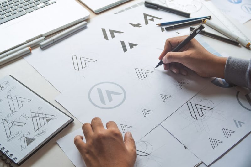 Designer sketching logos